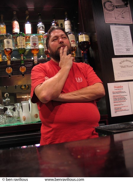 Barman Kim thinking: Millstone Lane, Leicester, 08 March 2004