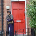 Woman watching carnival parade, Saxby Street, Leicester, 06 August 2005