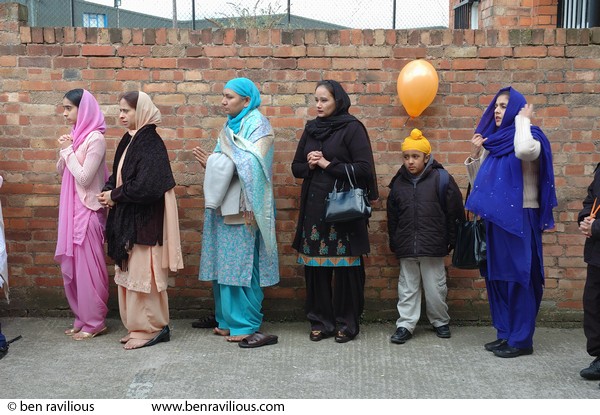 Women praying before Vaisakhi procession: Holy Bones, Leicester, 09 April 2006