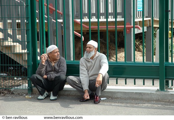 Two Muslim men having a smoke and a chat: Conduit Street, Leicester, 16 April 2006