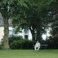 Man sitting on a park bench, Spinney Hill Park, Leicester, 04 June 2006