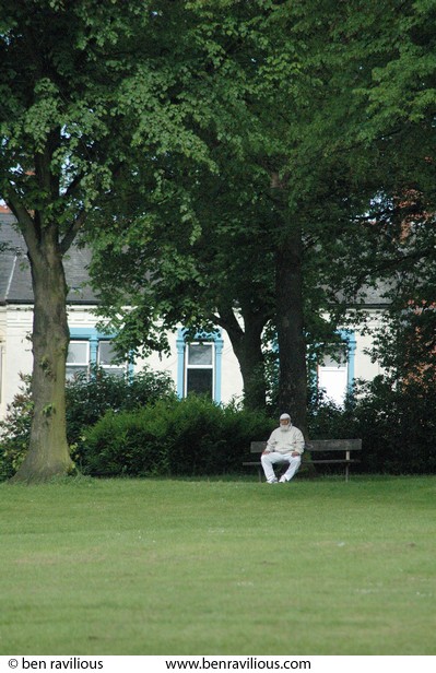 Man sitting on a park bench: Spinney Hill Park, Leicester, 04 June 2006