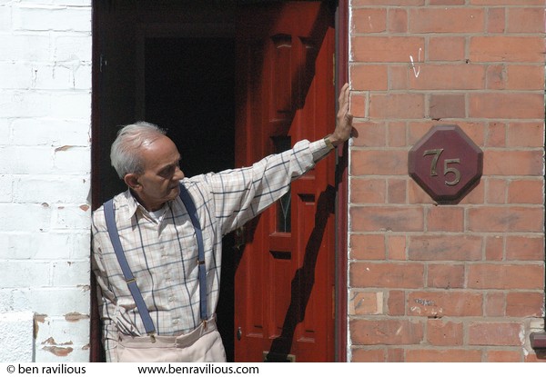 Man looking out onto street: Baggrave (or Asfordby?) Street, Spinney Hills, Leicester, 04 June 2006