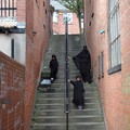Woman and girls walking down steps, Halstead Street, Spinney Hills, Leicester, 05 June 2006