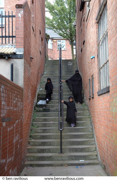 Woman and girls walking down steps: Halstead Street, Spinney Hills, Leicester, 05 June 2006