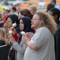 Spectators eating ice cream at an inter-faith cricket match, Imams vs Christian Clerics cricket match, Leicestershire Country Cricket Ground, Grace Road, Leicester, 11 September 2006