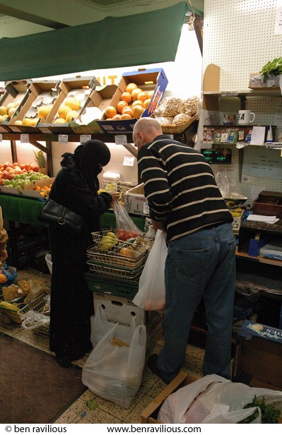 Greengrocer helping a customer: East Park Road, Spinney Hills, Leicester, 04 November 2006